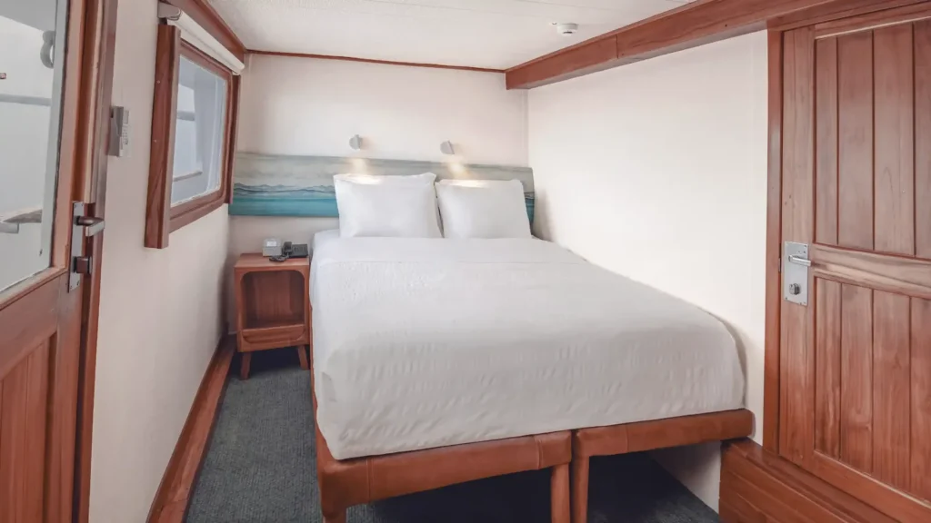 Junior cabin with a double bed on the Coral I