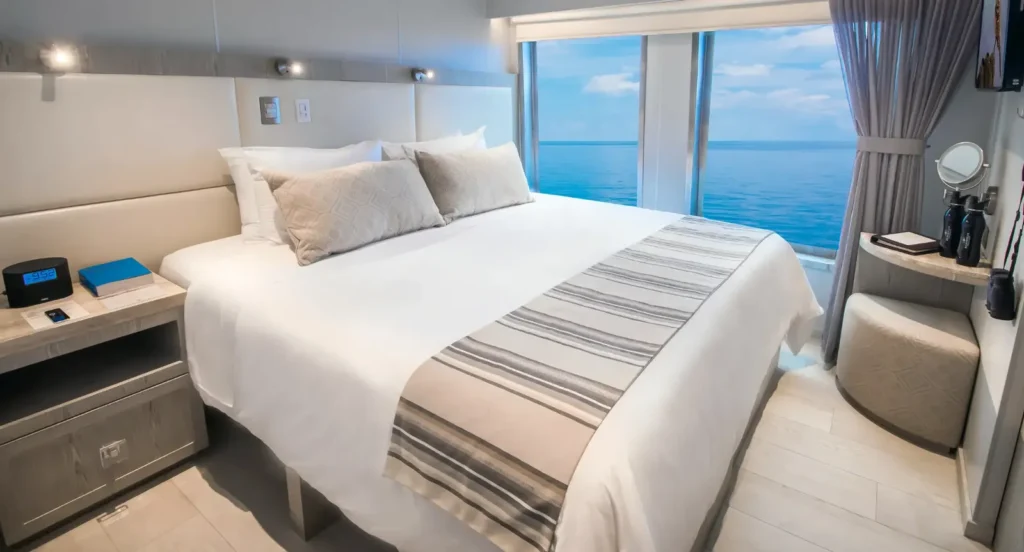 Stateroom with panoramic windows on an Ecoventura yacht