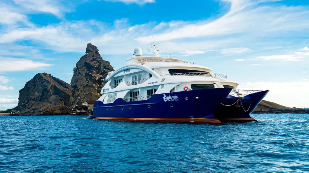 Endemic catamaran at Bartolomé, with Pinnacle Rock behind