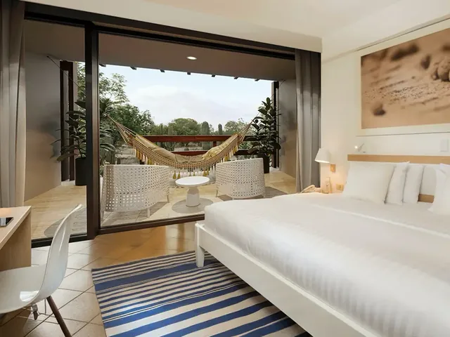 A Premium Room with a king bed and a hammock on the balcony (photo: Finch Bay Galápagos Hotel)