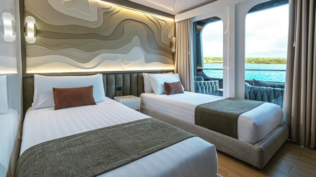 Cabin with twin beds and windows on the Galaxy Sirius