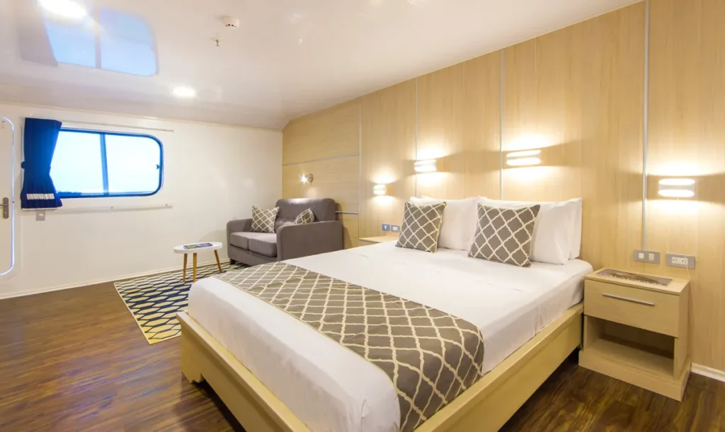 Cabin with a queen bed on the upper deck of the Solaris