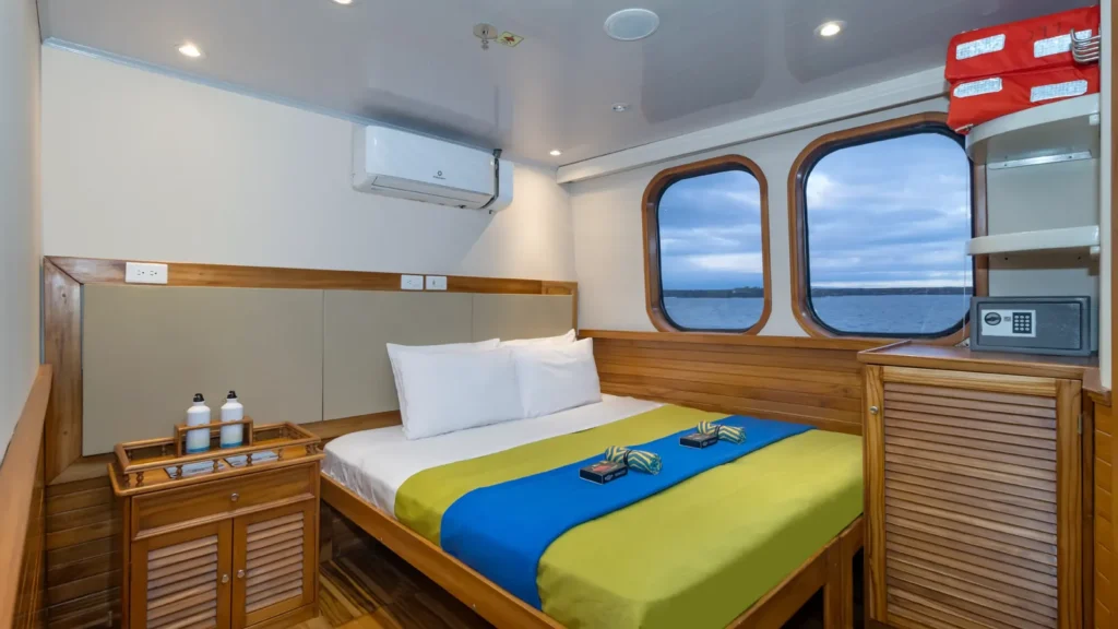 Upper-deck cabin with large windows on the Tip Top IV
